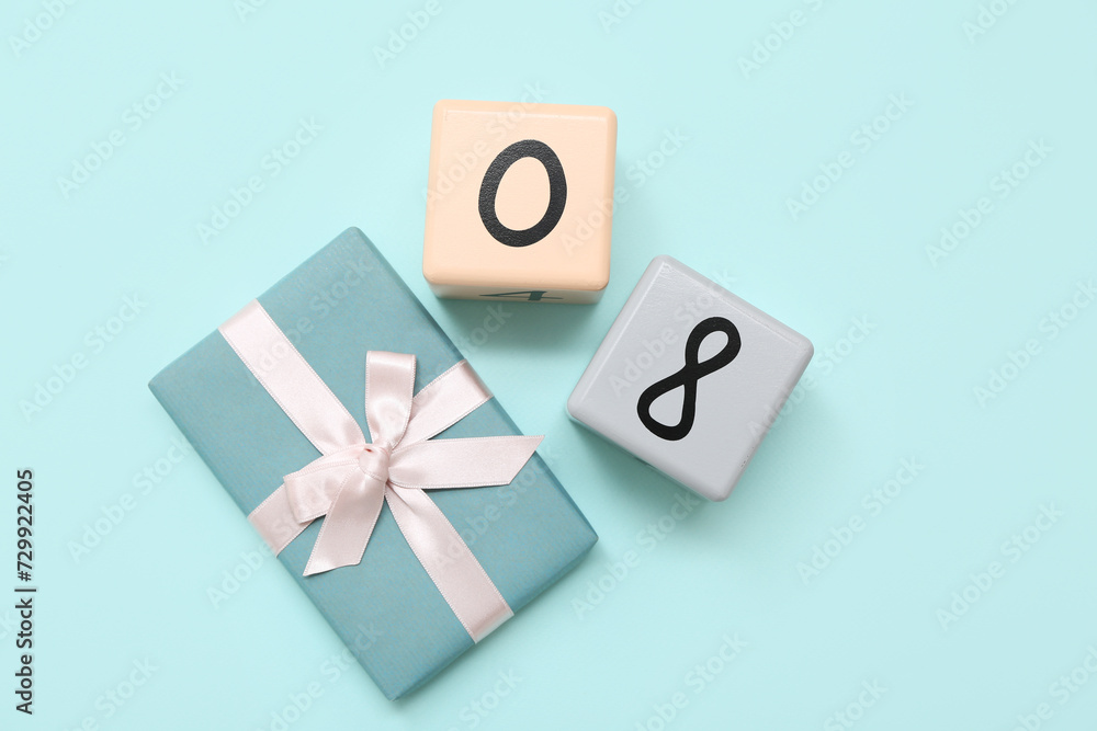 Cube calendar with date 08 and gift box on blue background. International Women's Day Cube calendar with date 08 and gift box on blue background. International Women's Day