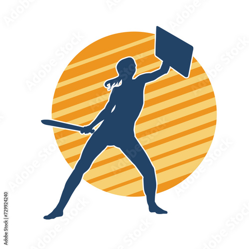 Silhouette of a female warrior in battle armor carrying sword weapon and iron shield.