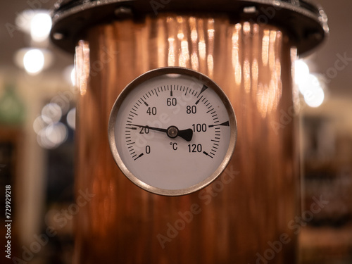 Thermometer at copper distillery still © wlad074