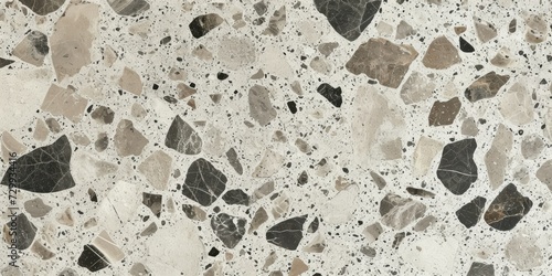 Terrazzo flooring texture with marble chips in neutral tones for background or design elements.