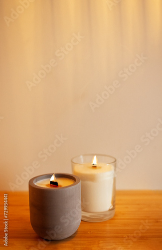 Wallpaper Mural Two lighted candles in a ceramic and glass candlestick on a wooden table. Torontodigital.ca