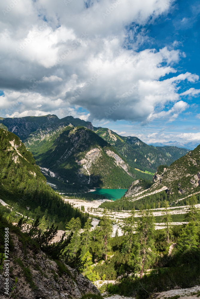 Fototapeta premium Pragser Wildsee lake with hills above in the Dolomites