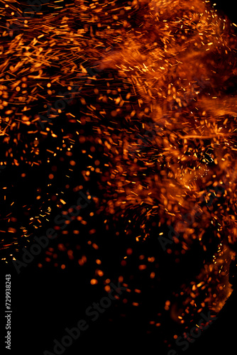fire flame with sparks on black background.