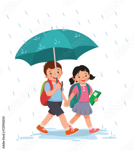 Cute little kids students with backpack holding umbrella walking to school in the rain
