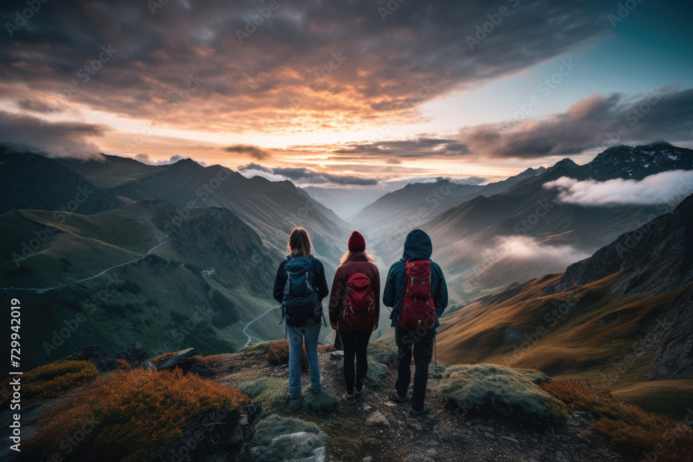 Obraz premium Group of tourists travelers hikers in the mountains