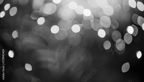 Beautiful monochrome bokeh blurred background with defocused lights