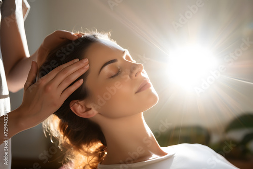 Woman receiving reiki therapy