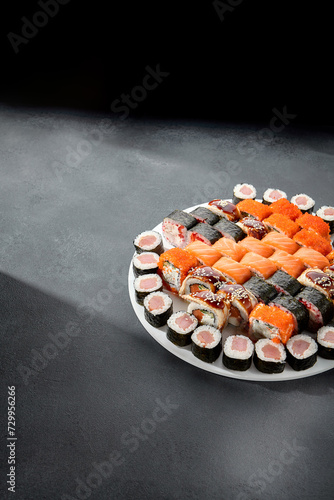 Assorted sushi and maki rolls platter with tuna, salmon, and eel, perfect for a Japanese cuisine experience