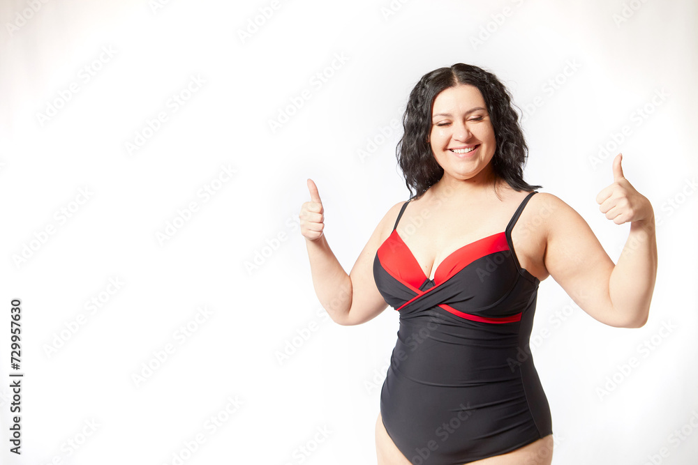Happy attractive thick woman in swimsuit posing on white background. Body positive, photoshoot, selfie. Funny plus size model. Winner in Weight loss Happy attractive thick woman in swimsuit posing on white background. Body positive, photoshoot, selfie. Funny plus size model. Winner in Weight loss