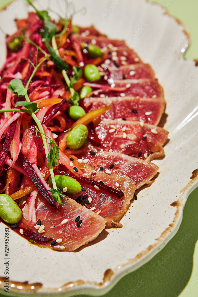 Close-up of tuna tataki with julienne vegetables and sesame seeds, a macro showcase of healthy gourmet dining Close-up of tuna tataki with julienne vegetables and sesame seeds, a macro showcase of healthy gourmet dining