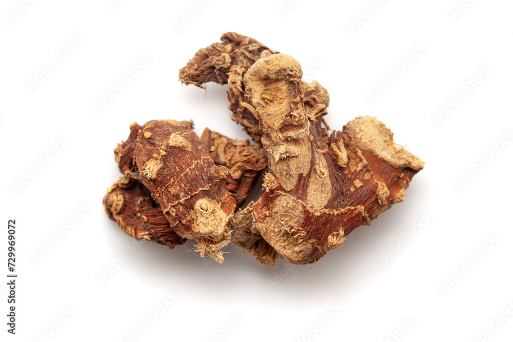 Top-down view of Dry Organic Kulanjan (Alpinia galanga) roots, isolated on a white background.