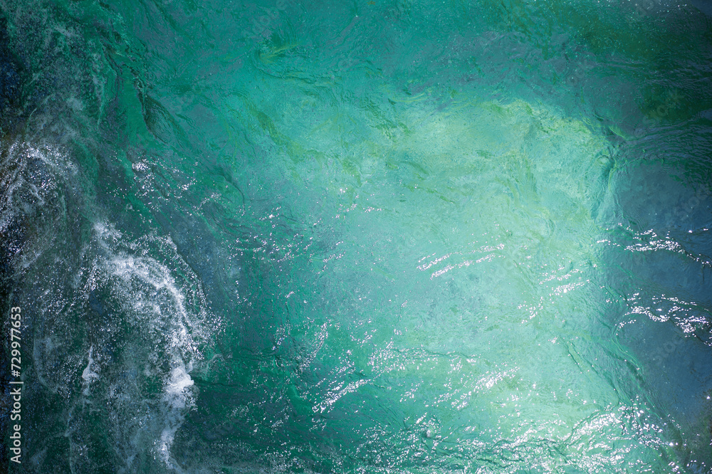 Obraz premium clear clean turquoise water of an alpine mountain river