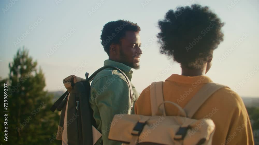 Observing Rear View Rear view of African American couple speaking with each other while ...
