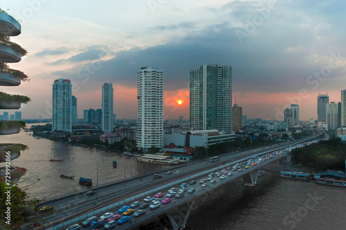 Beautiful sunset of skyscrapers, coast and traffic jams of the city of Bangkok (Thailand)