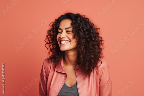 Portrait of happy young african american woman with curly hair.