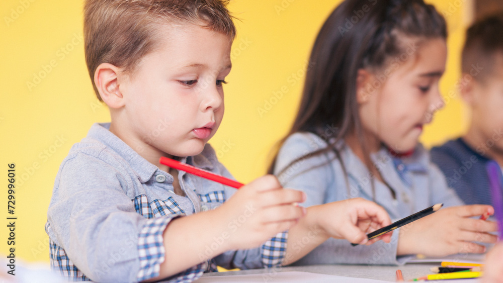Children drawing in the classroom Children drawing in the classroom