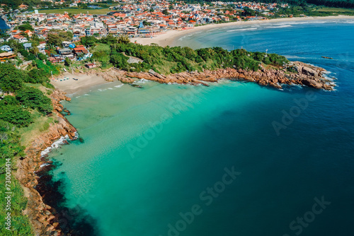 Beach with rocks and ocean in Brazil. Drone view of coastline beach in Florianopolis