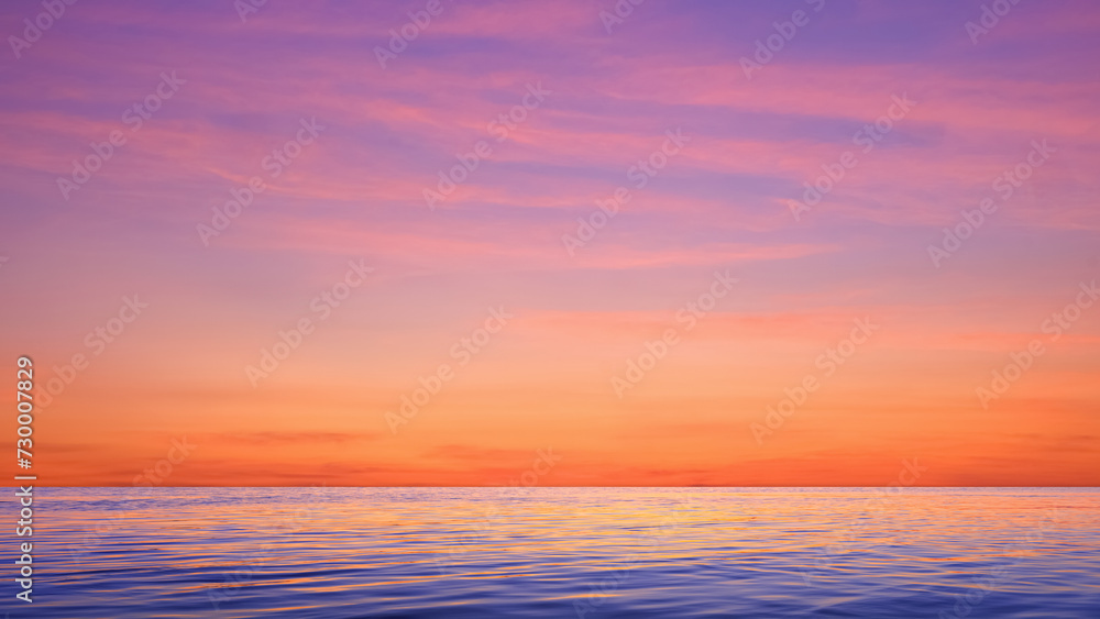 Colorful dramatic sunset sky background over sea with beautiful pink sunrise clouds and light reflection on water surface in the evening after sundown. Idyllic twilight seascape view