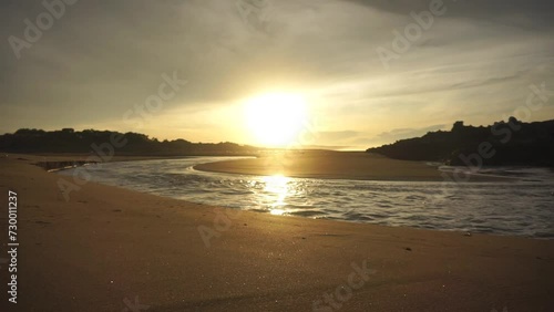 beautiful view of the sunrise on the beach with small waves, morning natural panorama on Karang Paranje beach, Garut photo