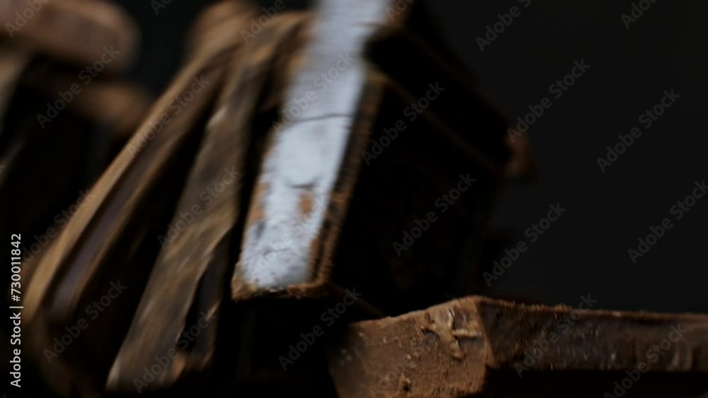 Chocolate in fine detail, cocoa powder enhancing its dark allure. Ideal for themes of culinary passion and chocolate craftsmanship. Chocolate in fine detail, cocoa powder enhancing its dark allure. Ideal for themes of culinary passion and chocolate craftsmanship.