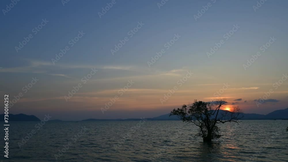 4K Time lapse video of beautiful scenery seascape in the west coast of phuket island during sunset. Idyllic dusk scene of the sea with fast movement clouds in blue sky. Thailand. 4K Time lapse video of beautiful scenery seascape in the west coast of phuket island during sunset. Idyllic dusk scene of the sea with fast movement clouds in blue sky. Thailand.