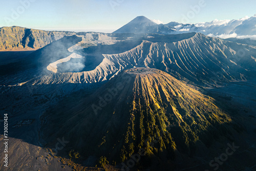 Aerial view of Mount Bromo, Mount Batok, and Mount Semeru as the highest mountain in Java island (Indonesia) photo