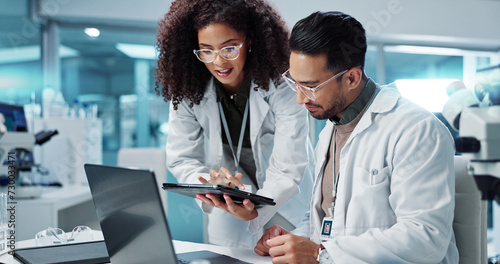 Science, teamwork and scientist with tablet in laboratory for communication, pharmaceutical review or planning. Employees, collaboration and technology for research, discussion and digital analysis photo