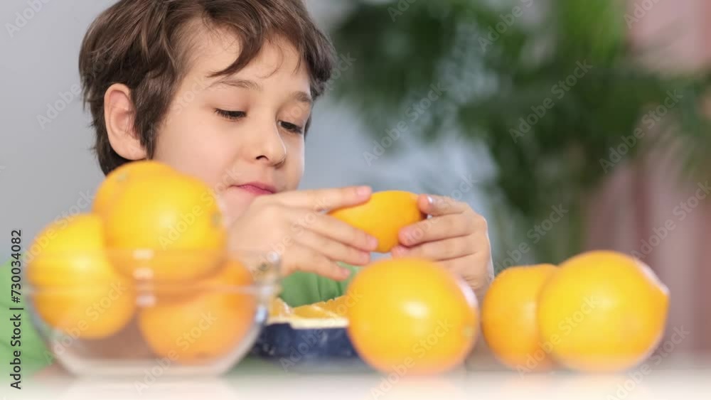 The boy inhales deeply, appreciating the fresh citrus aroma, a moment embracing healthy habits. The boy inhales deeply, appreciating the fresh citrus aroma, a moment embracing healthy habits.