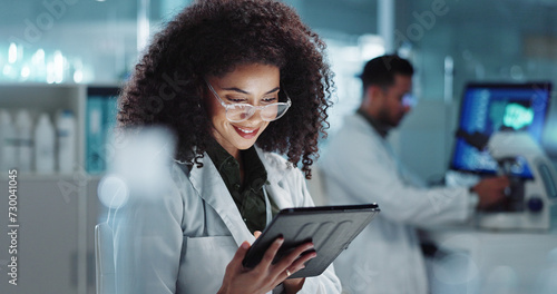 Tablet, reading and woman scientist in laboratory working on medical research, project or experiment. Science, career and female researcher with digital technology for pharmaceutical innovation. photo