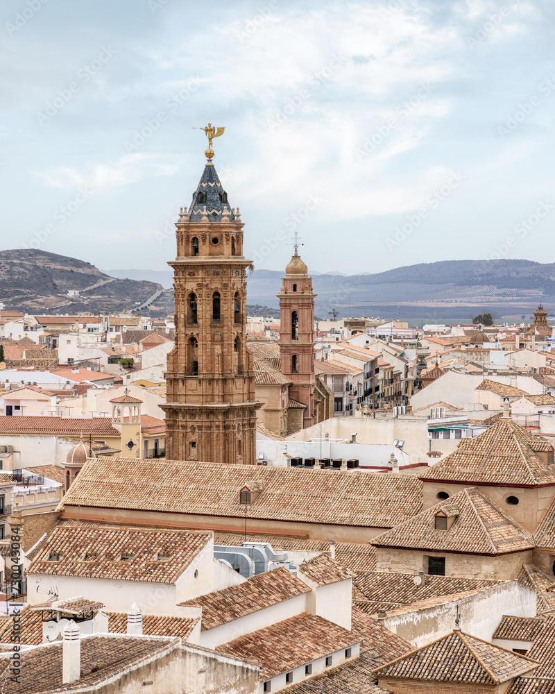 Stunning aerial shot showcasing the charm of an ancient bell tower in Antequera, Spain.