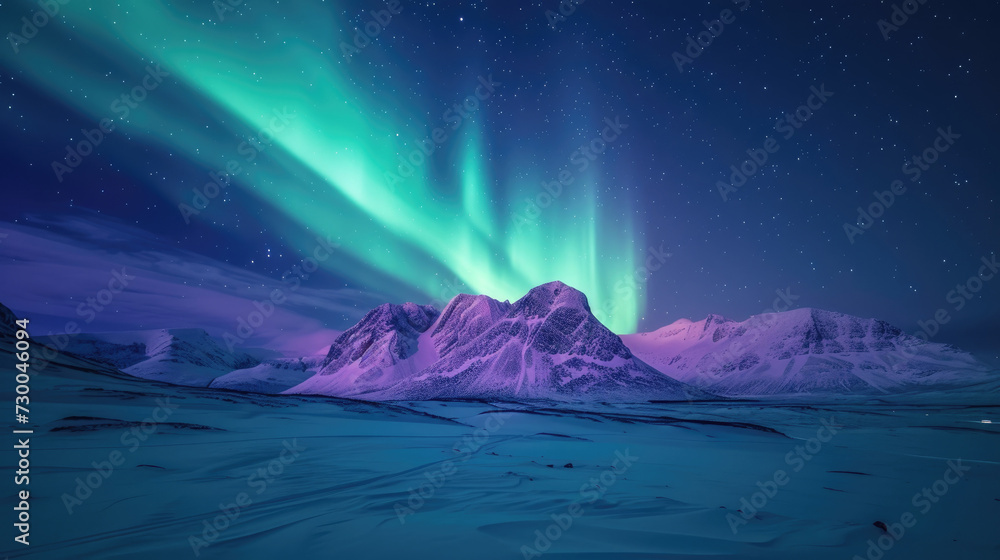 Stunning view of the vibrant Aurora Borealis with bright colors over a snowy mountain landscape