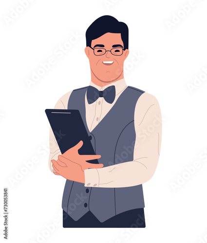 Down Syndrome waiter working in restaurant. Social inclusion concept. Confident man waitress wearing uniform and bow tie standing with digital tablet
