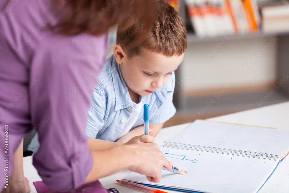 Teacher learning child in classroom School education concept Teacher learning child in classroom School education concept
