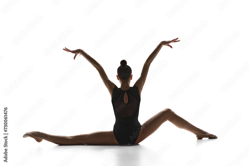 Talent show. Artistic, beautiful, elegant teen girl rhythmic gymnast performing against white studio background. Concept of sport, beauty and grace, competition, art, youth, hobby Talent show. Artistic, beautiful, elegant teen girl rhythmic gymnast performing against white studio background. Concept of sport, beauty and grace, competition, art, youth, hobby