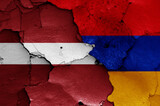 flags of Latvia and Armenia painted on cracked wall