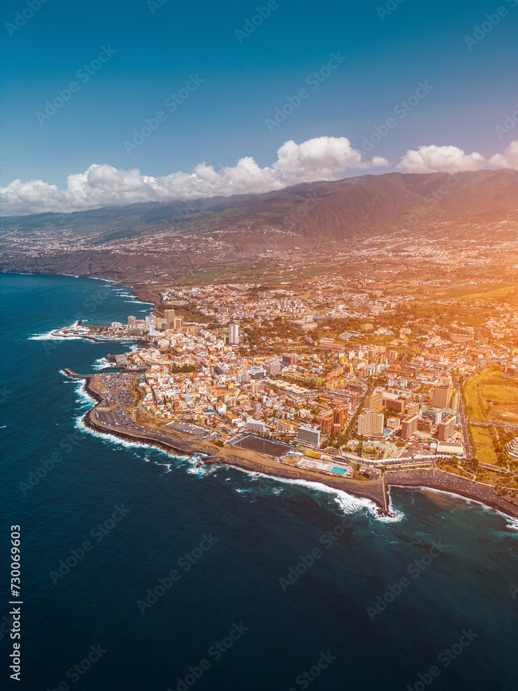 ocean shore with blue water and city Puerto De La Cruz, Tenerife, Canary island