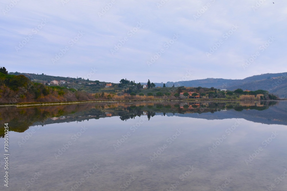 Mediterranean coast of the Adriatic sea at Strunjan with a reflection of the hill with buildings in Primorska, Slovenia