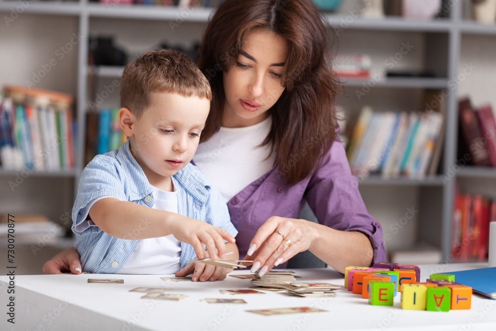 Teacher learning little child in classroom. Preschool education concept Teacher learning little child in classroom. Preschool education concept