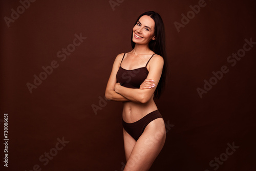 Profile portrait of attractive perfect shape cheerful girl folded hands empty space isolated on brown color background