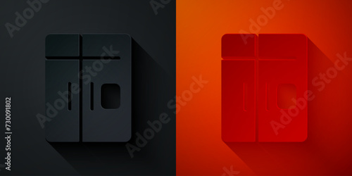 Paper cut Refrigerator icon isolated on black and red background. Fridge freezer refrigerator. Household tech and appliances. Paper art style. Vector
