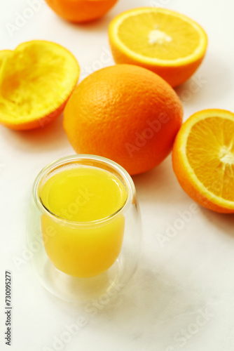 Fresh ripe juicy oranges on light background