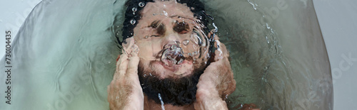 Obraz na plátně frustrated depressed man drowning in bathtub during breakdown, mental health awa