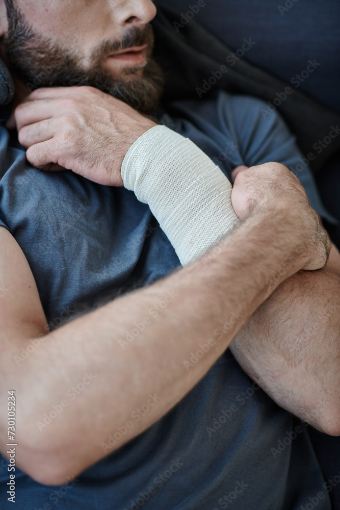 cropped view of depressed man with bandage on arm after attempting suicide, mental health awareness cropped view of depressed man with bandage on arm after attempting suicide, mental health awareness