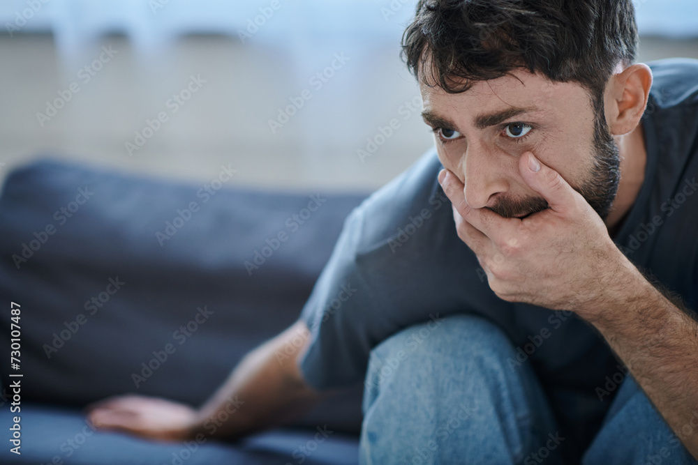 anxious man in everyday t shirt closing his mouth during depressive episode, mental health awareness anxious man in everyday t shirt closing his mouth during depressive episode, mental health awareness