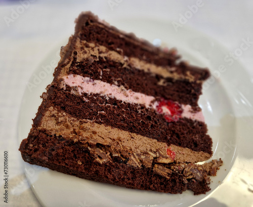 chocolate cake frosting for men. a marzipan plate on the side to indicate the year of birth. sliced ​​raspberries and strawberries. bavrchu in a circle. Parisian whipped cream. luxury, leather, flower