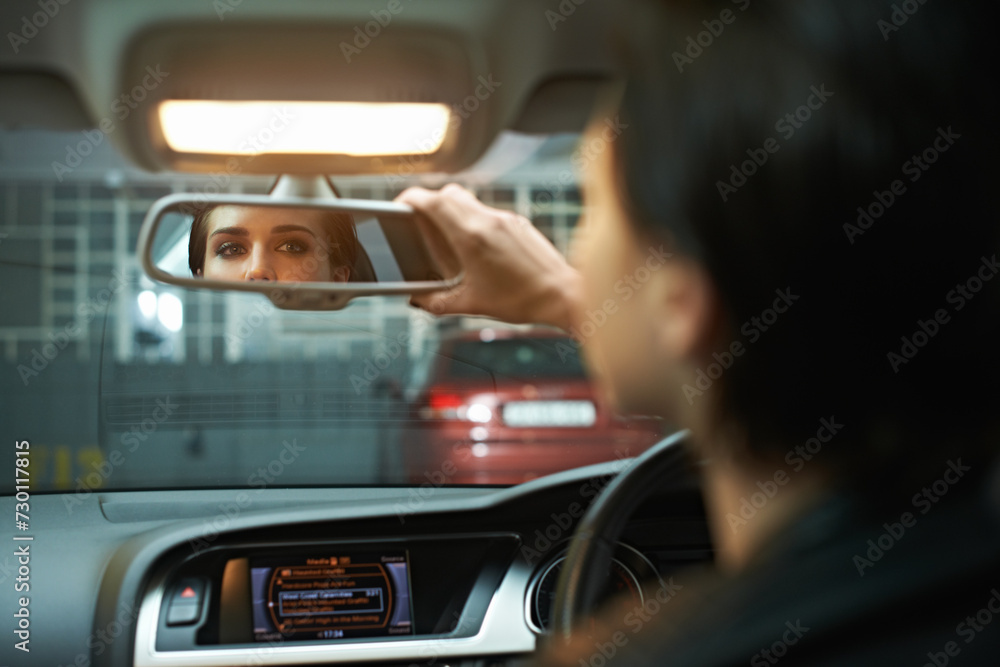 Woman, car and checking mirror in parking lot for observation, awareness or transportation. Female person or driver looking in rear view reflection for drive, reverse or interior check in vehicle