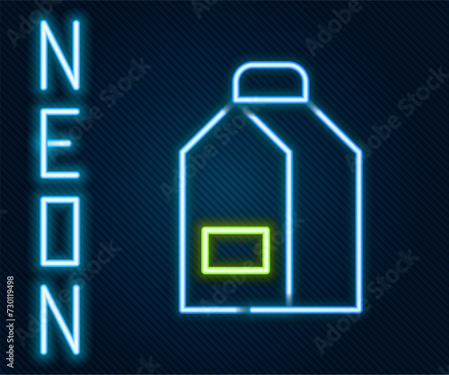 Glowing neon line Paper package for milk icon isolated on black background. Milk packet sign. Colorful outline concept. Vector