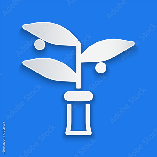 Paper cut Plant breeding icon isolated on blue background. Plants growing in the test tubes. Organic food ,agriculture and hydroponic. Paper art style. Vector