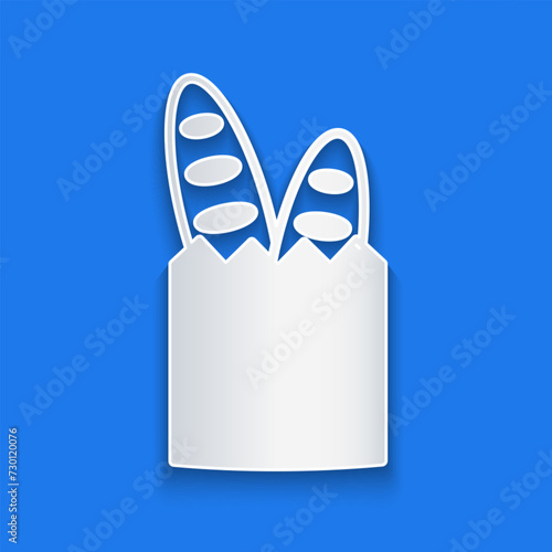 Paper cut French baguette bread icon isolated on blue background. Paper art style. Vector
