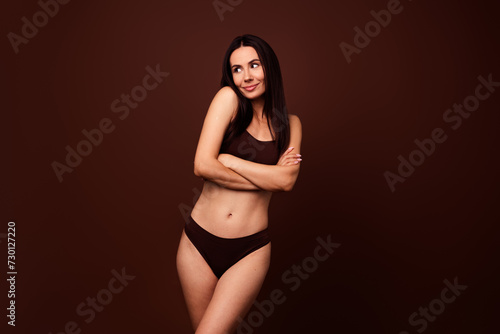 Photo of lovely charming girl crossed arms wear stylish activewear no filter skin beautiful perfect body isolated on brown color background © deagreez
